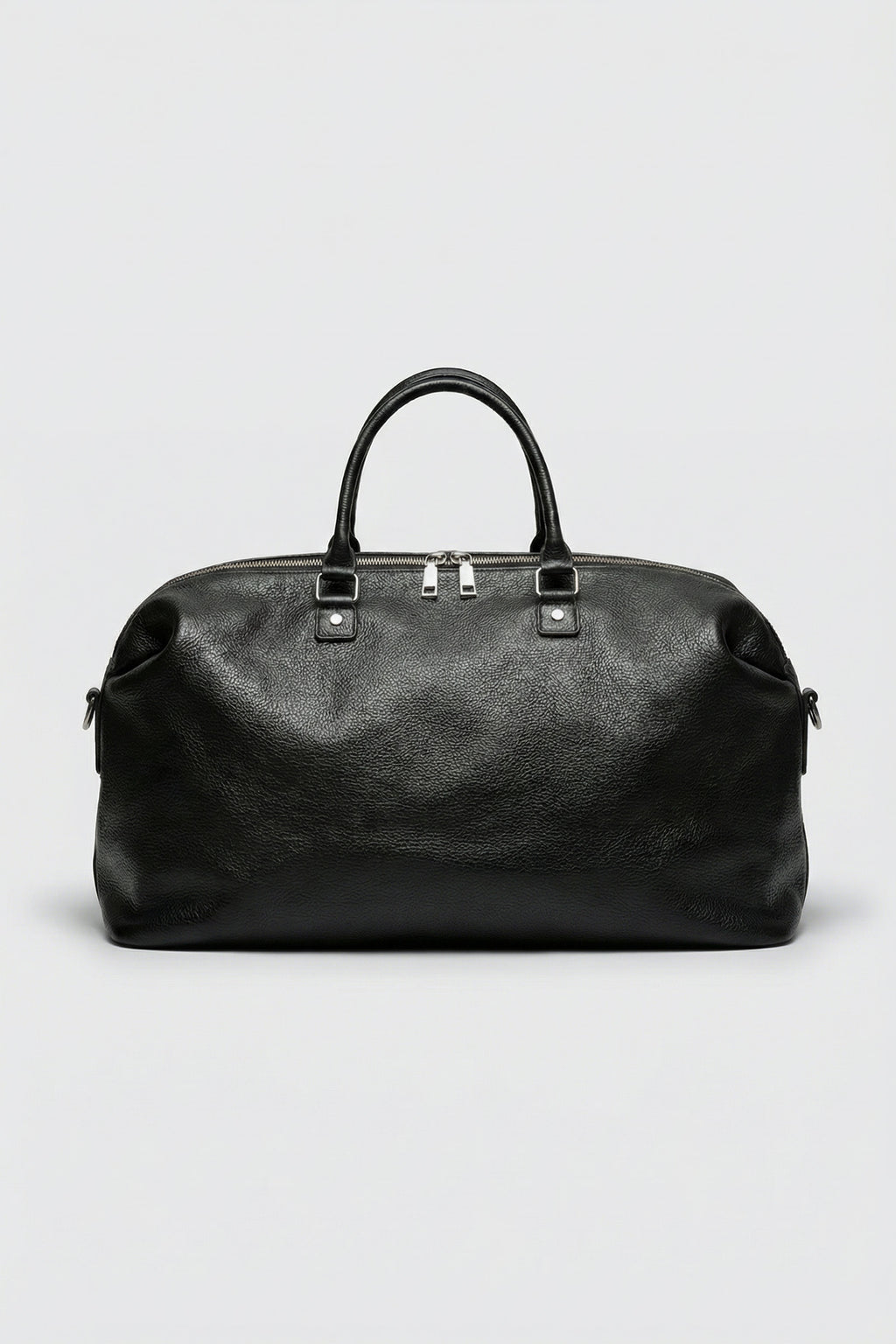 Top-grain luxury black leather executive duffle bag for business travel and gym use.