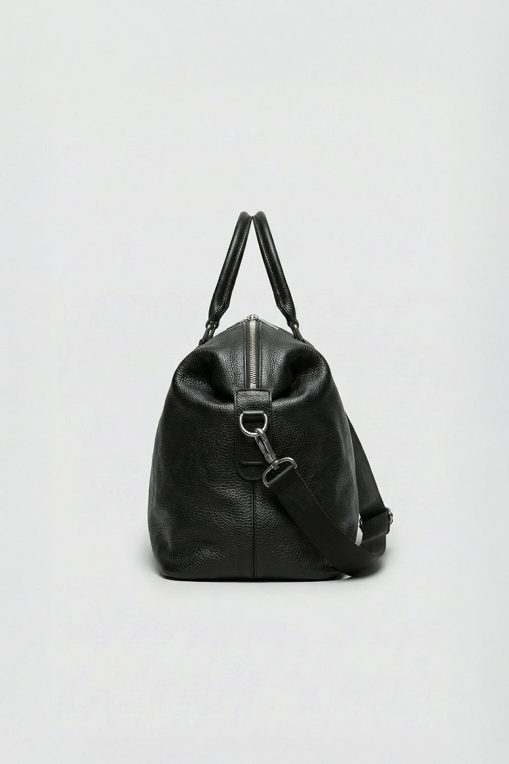 High-quality black leather overnight bag made from premium top-grain hide.