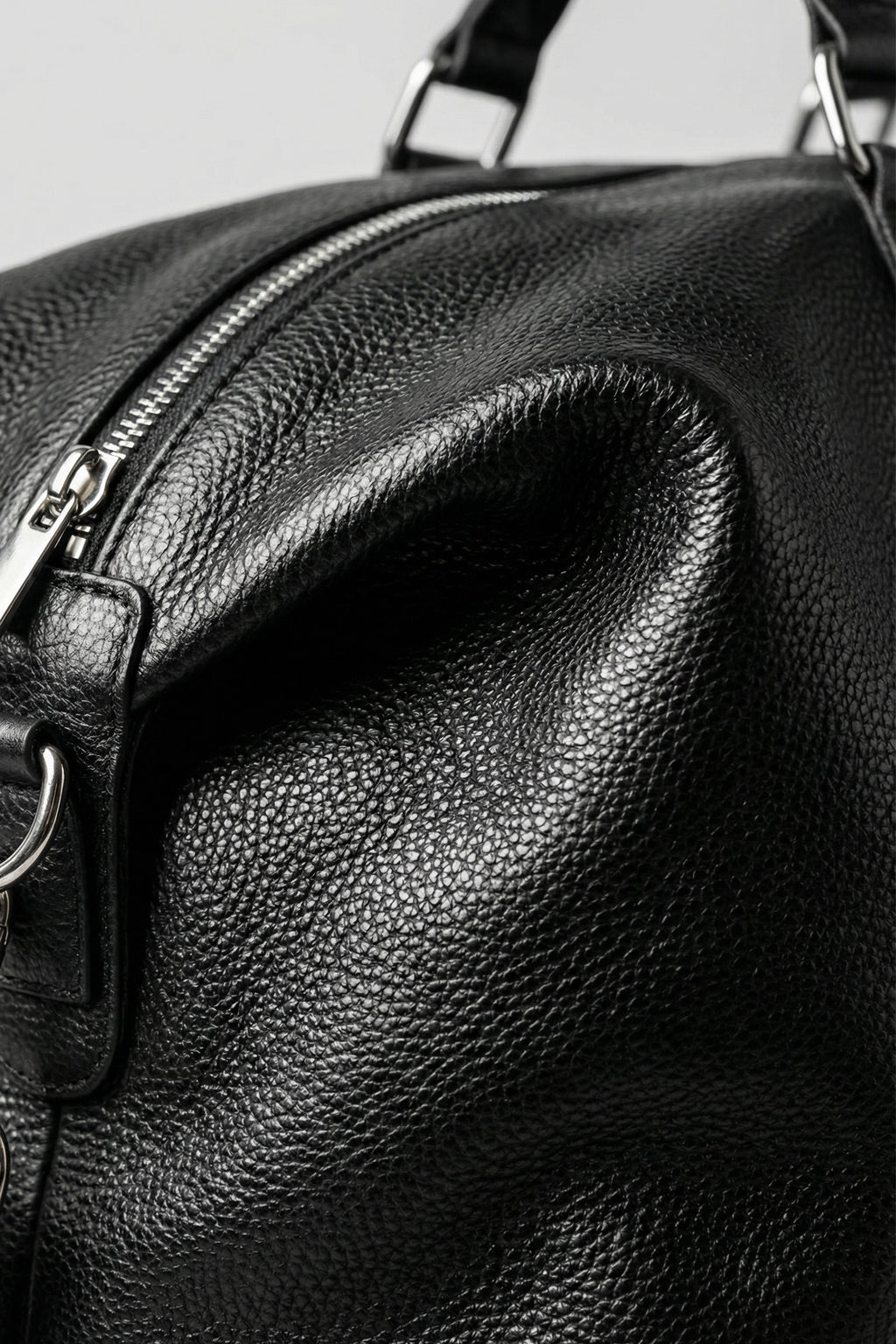 Handcrafted smooth leather duffle built for lifetime durability and style.