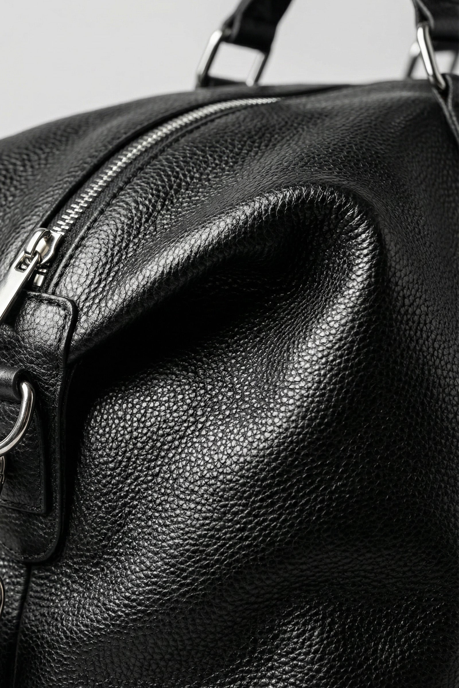 Handcrafted smooth leather duffle built for lifetime durability and style.